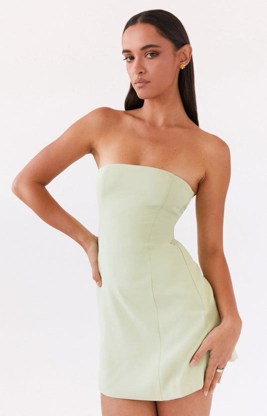 A woman wearing light green dress from Peppermayo's new arrivals collection